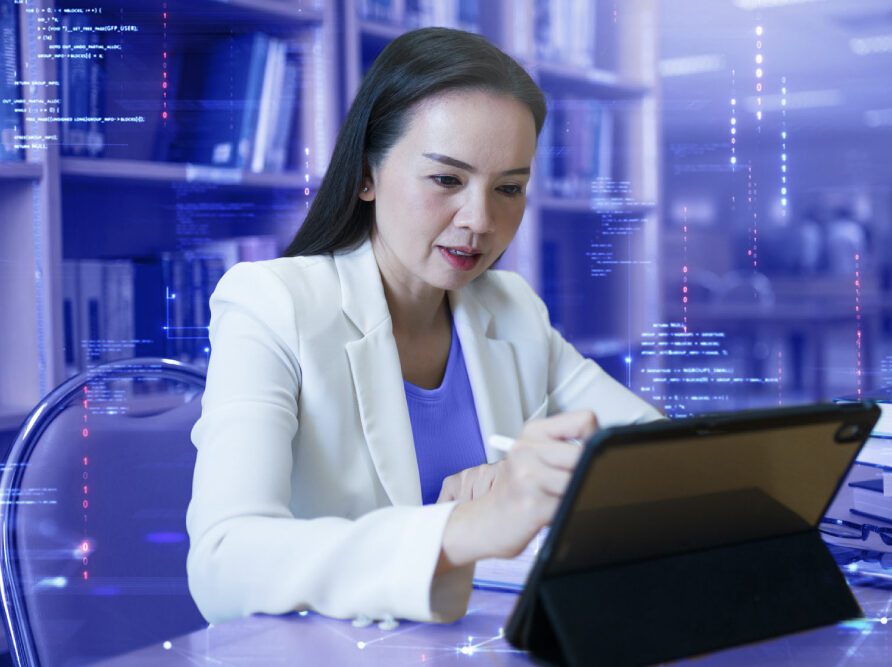 doctor in white coat at computer