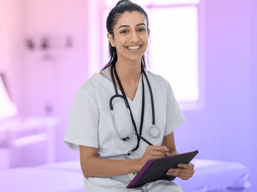 Nurse holding iPad with EHR software.